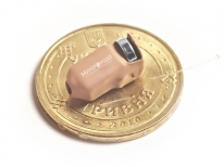 Микронаушник на монете Микронаушник на монете